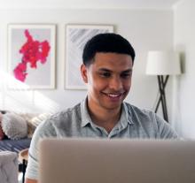 man seated at computer