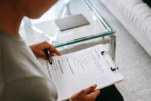 woman with clipboard of counselling notes