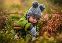 young boy in grass