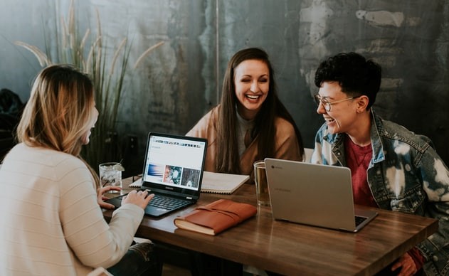 three adult students studying together